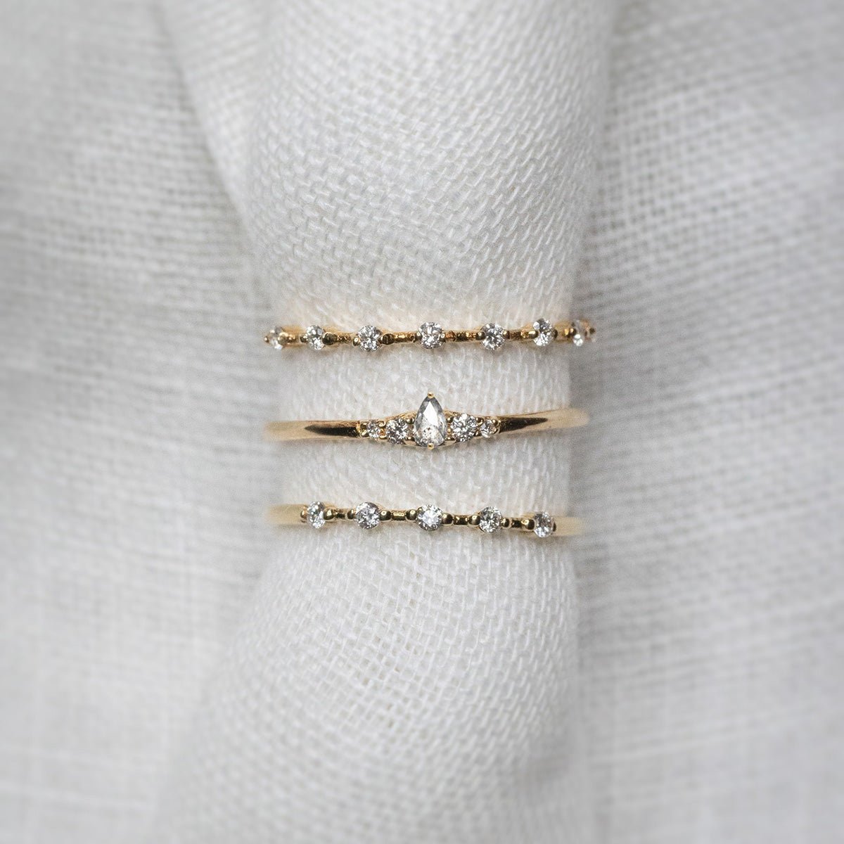 Wee Light Salt and Pepper Pear Diamond Ripple Band - Lelya - bespoke engagement and wedding rings made in Scotland, UK
