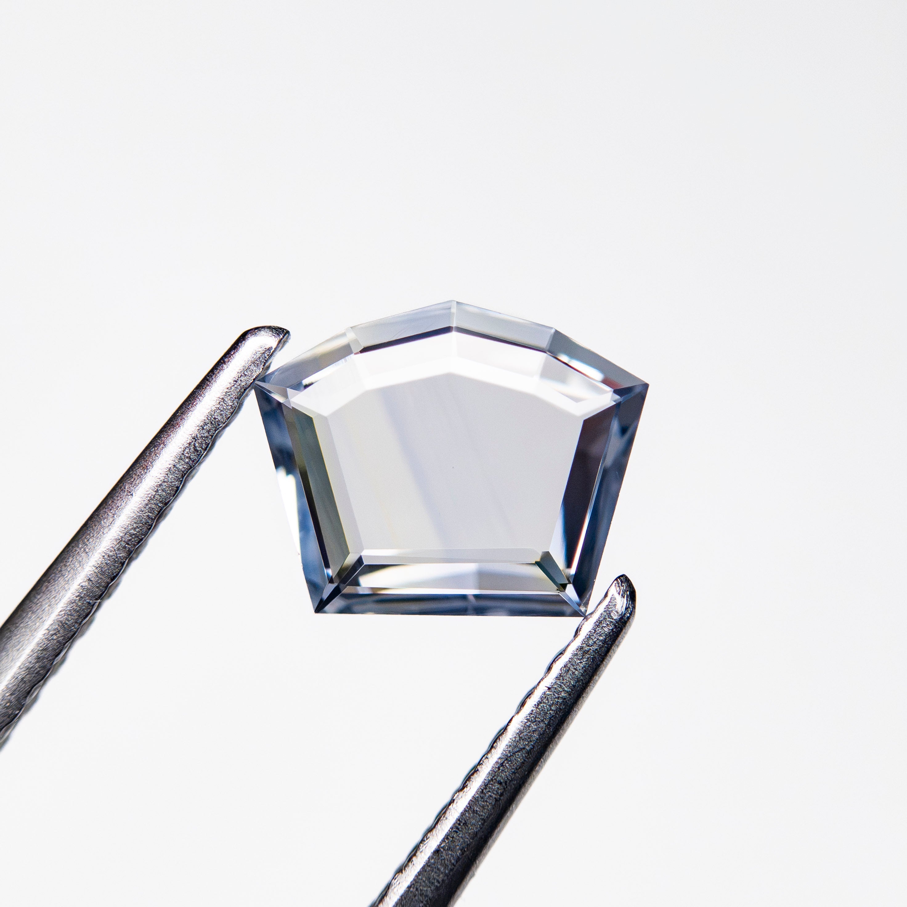 0.59ct 5.61x7.04x1.35mm Shield Portrait Cut Sapphire 27740-13 - Lelya - bespoke engagement and wedding rings made in Scotland, UK