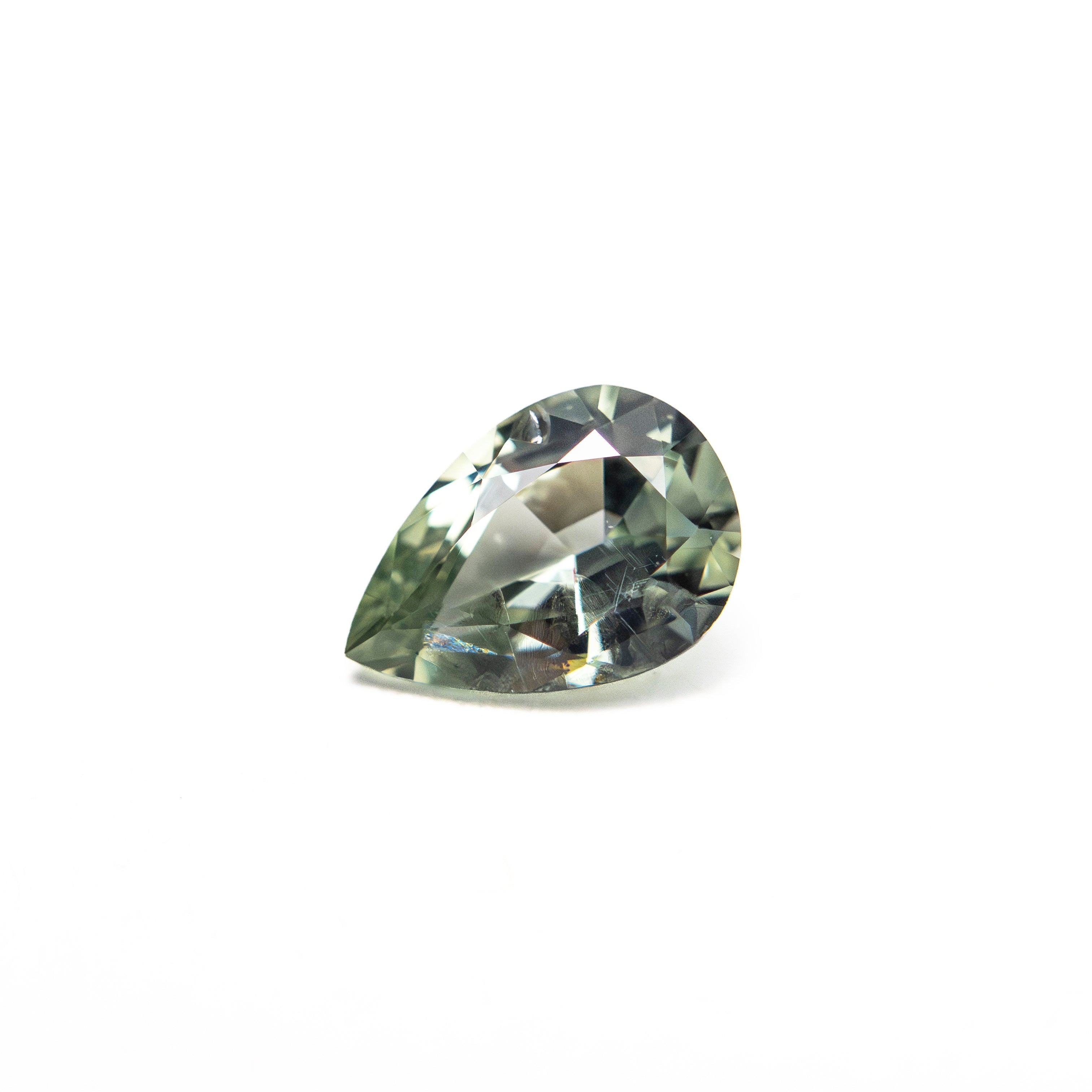 0.61ct 6.48x4.53x2.91mm Pear Brilliant Sapphire 26574-01 - Lelya - bespoke engagement and wedding rings made in Scotland, UK
