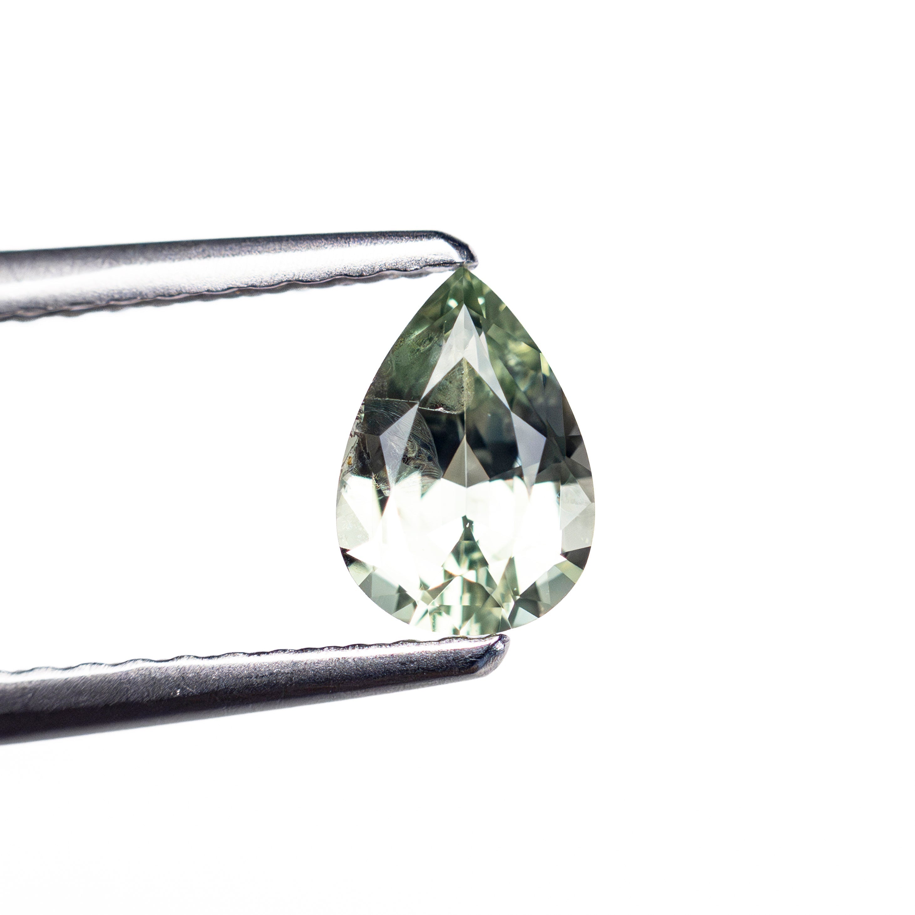 0.61ct 6.48x4.53x2.91mm Pear Brilliant Sapphire 26574-01 - Lelya - bespoke engagement and wedding rings made in Scotland, UK