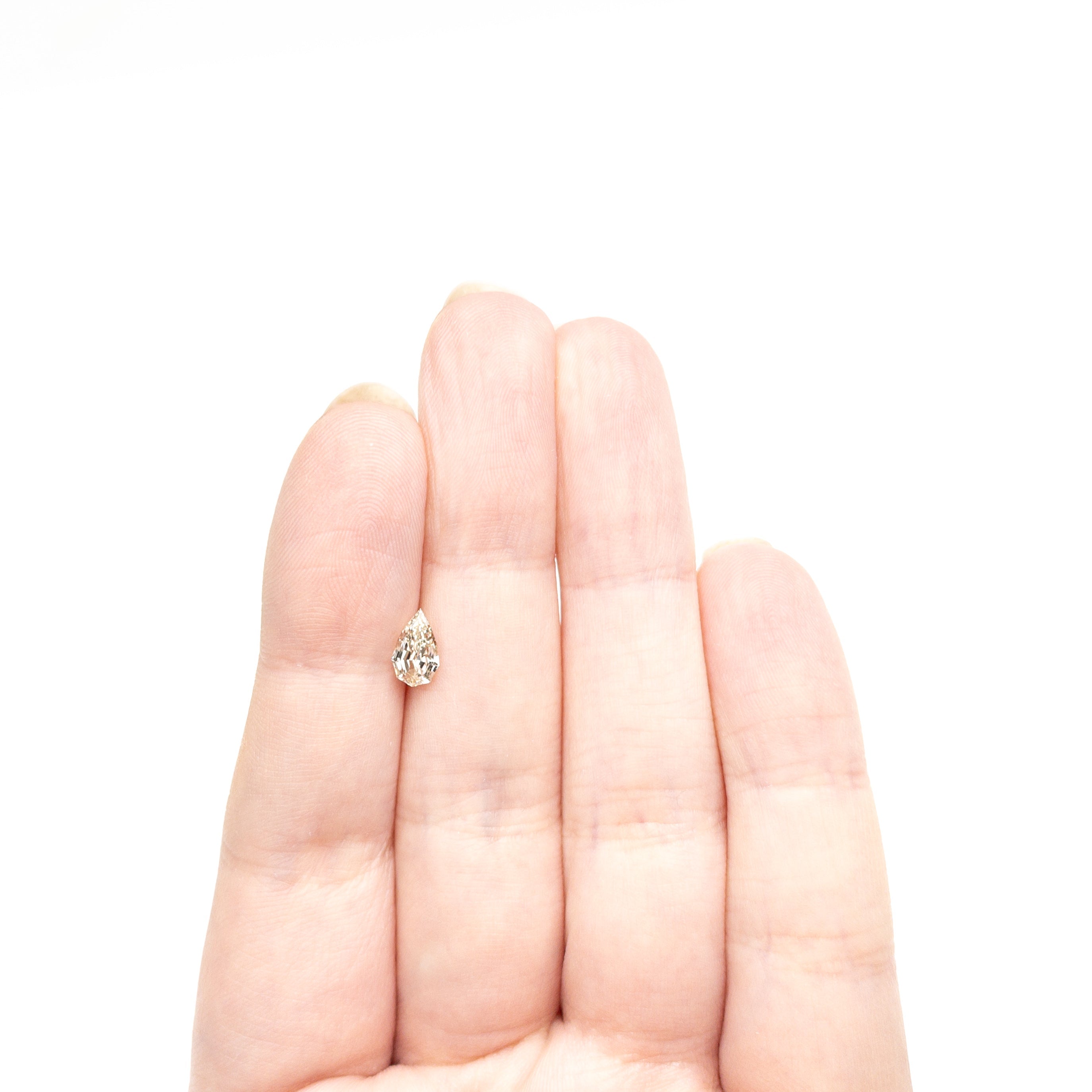 0.71ct 7.85x4.68x2.90mm VVS2 Q - R Geo Pear Step Cut 🇿🇦 27364 - 15 - Lelya - bespoke engagement and wedding rings made in Scotland, UK