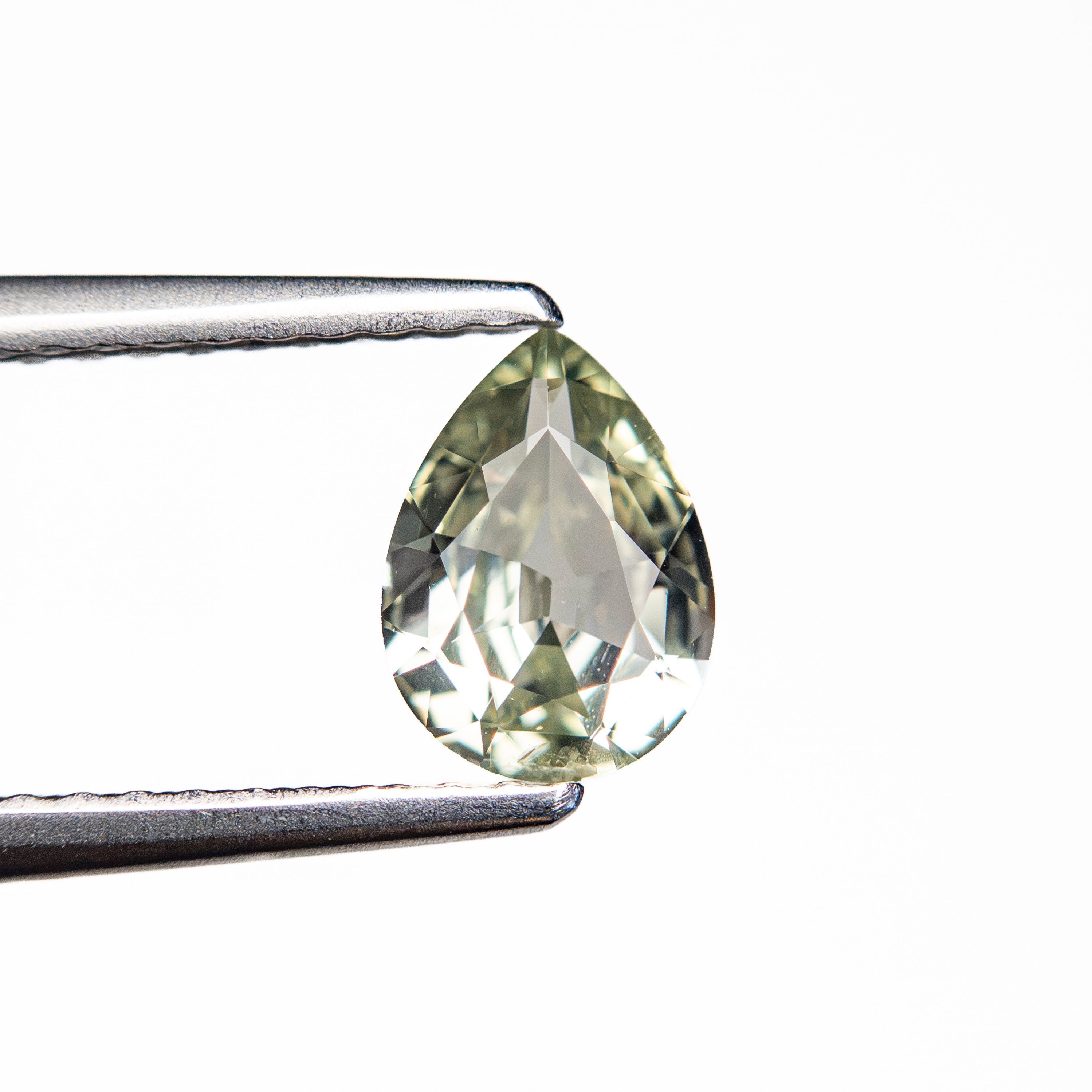 0.72ct 6.95x5.10x2.74mm Pear Brilliant Sapphire 26150-05 - Lelya - bespoke engagement and wedding rings made in Scotland, UK