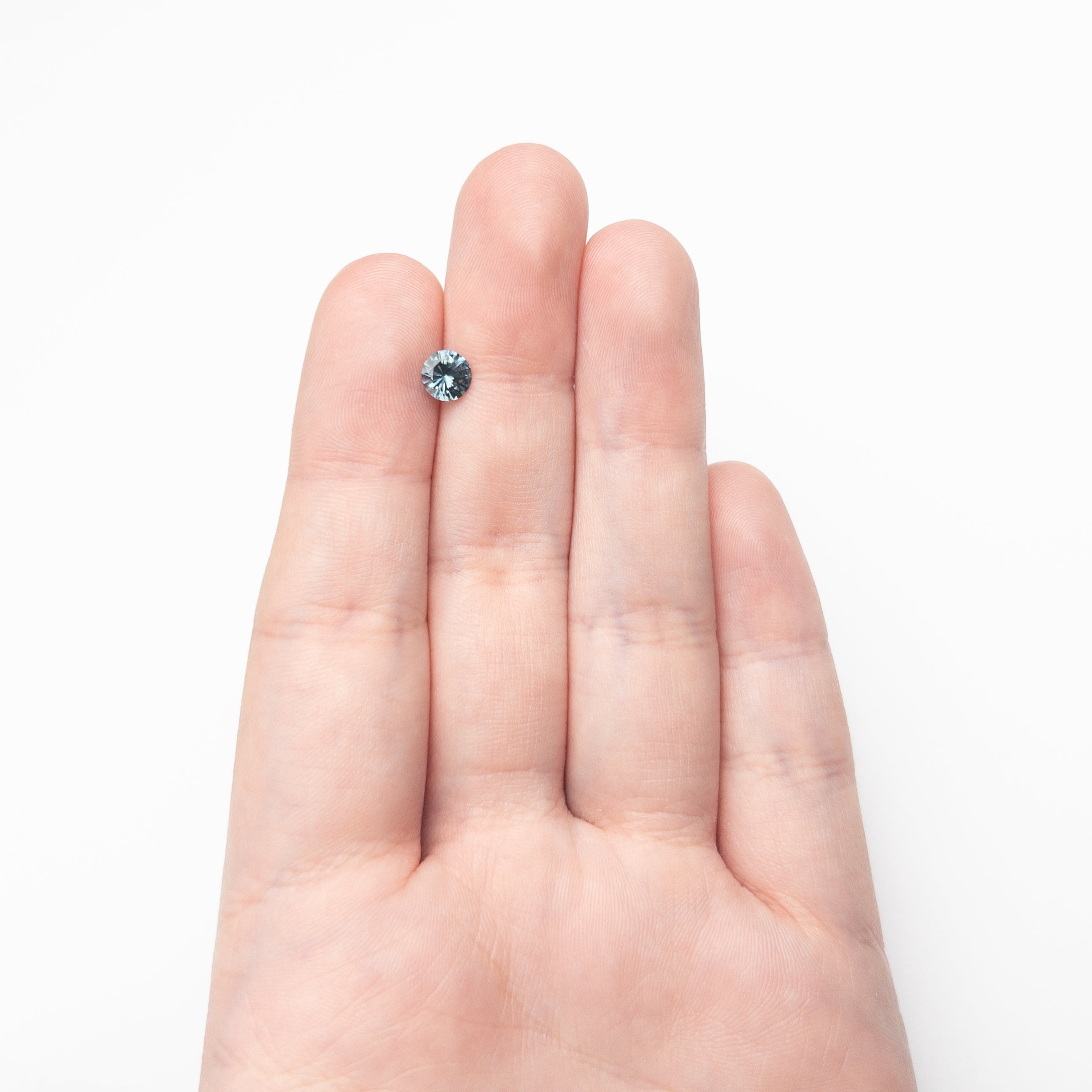 0.76ct 5.56x5.55x3.45mm Round Brilliant Sapphire 26134-10 - Lelya - bespoke engagement and wedding rings made in Scotland, UK