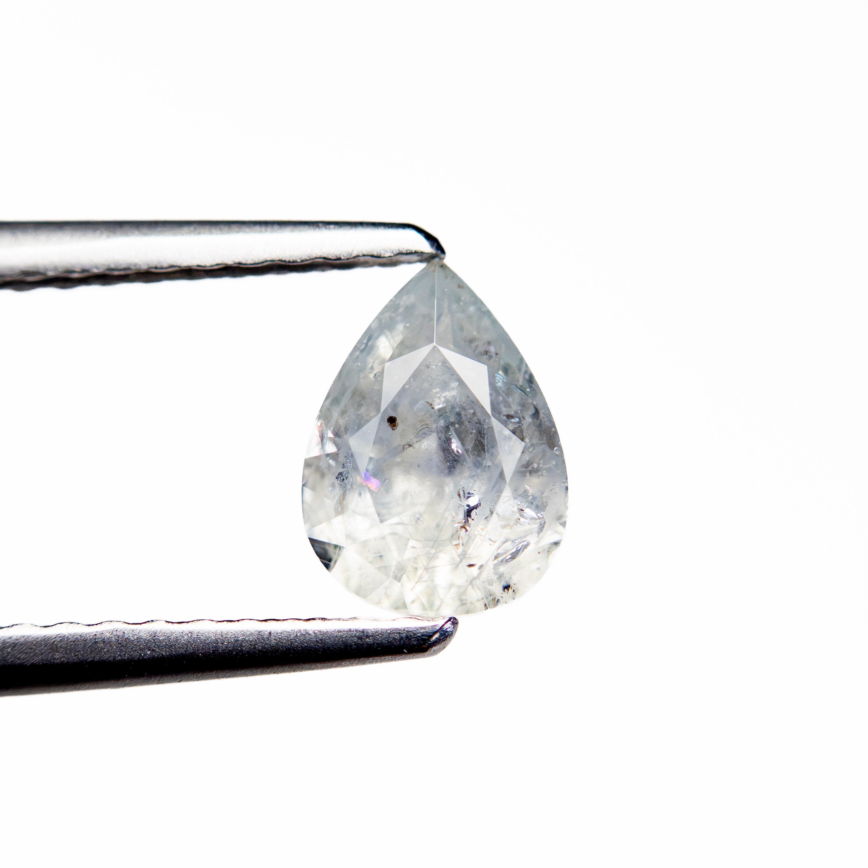 0.76ct 6.97x5.07x3.07mm Pear Brilliant Sapphire 26150-04 - Lelya - bespoke engagement and wedding rings made in Scotland, UK