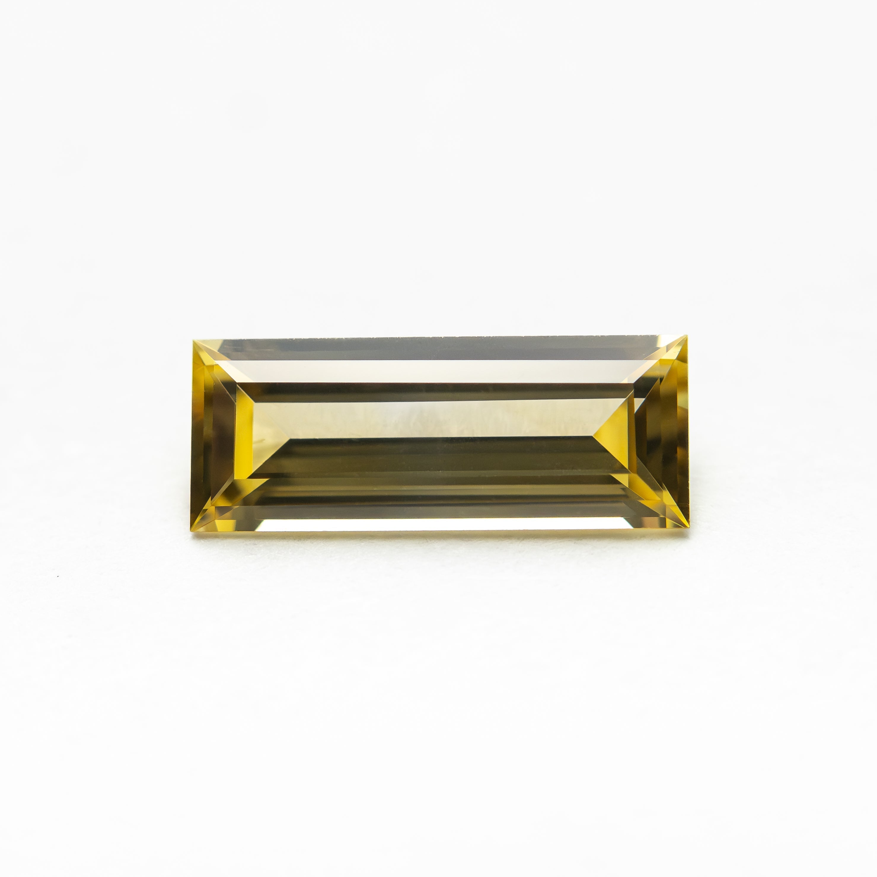 0.79ct 9.06x3.55x2.21mm Baguette Step Cut Sapphire 27719-05 - Lelya - bespoke engagement and wedding rings made in Scotland, UK