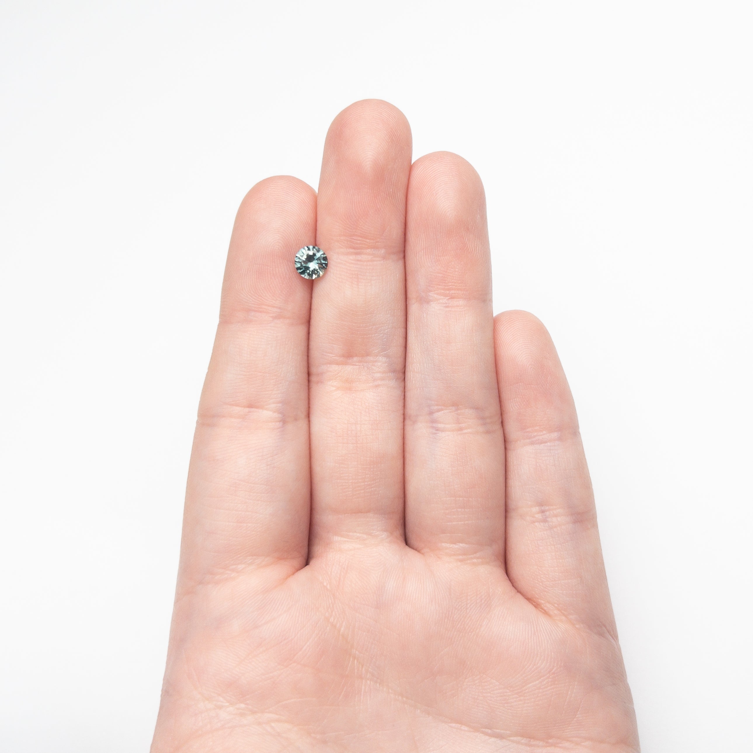 0.81ct 5.54x5.51x3.56mm Round Brilliant Sapphire 26134-24 - Lelya - bespoke engagement and wedding rings made in Scotland, UK