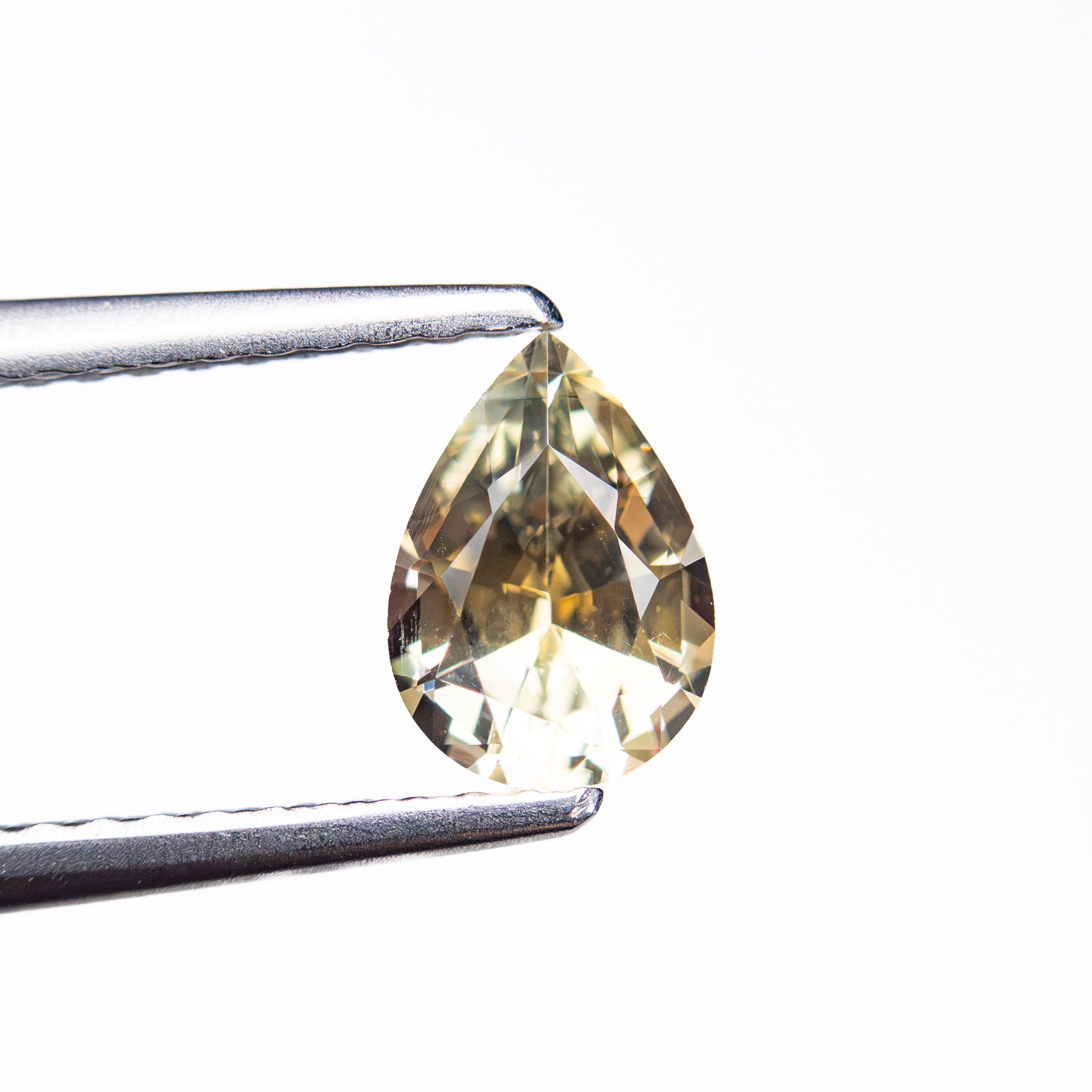 0.84ct 6.96x5.00x3.43mm Pear Brilliant Sapphire 26150-02 - Lelya - bespoke engagement and wedding rings made in Scotland, UK