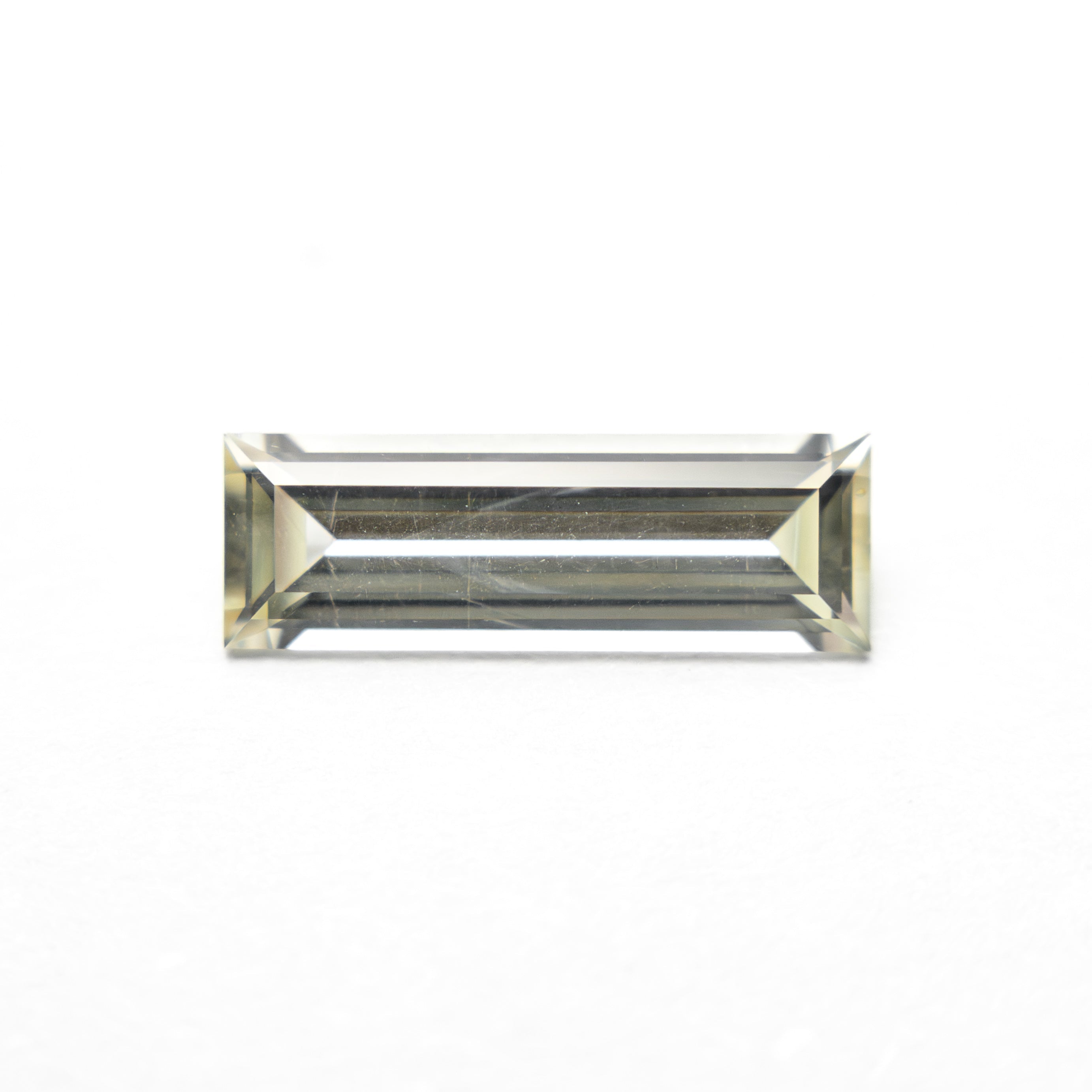 0.84ct 9.95x3.36x2.17mm Baguette Step Cut Sapphire 27719 - 01 - Lelya - bespoke engagement and wedding rings made in Scotland, UK