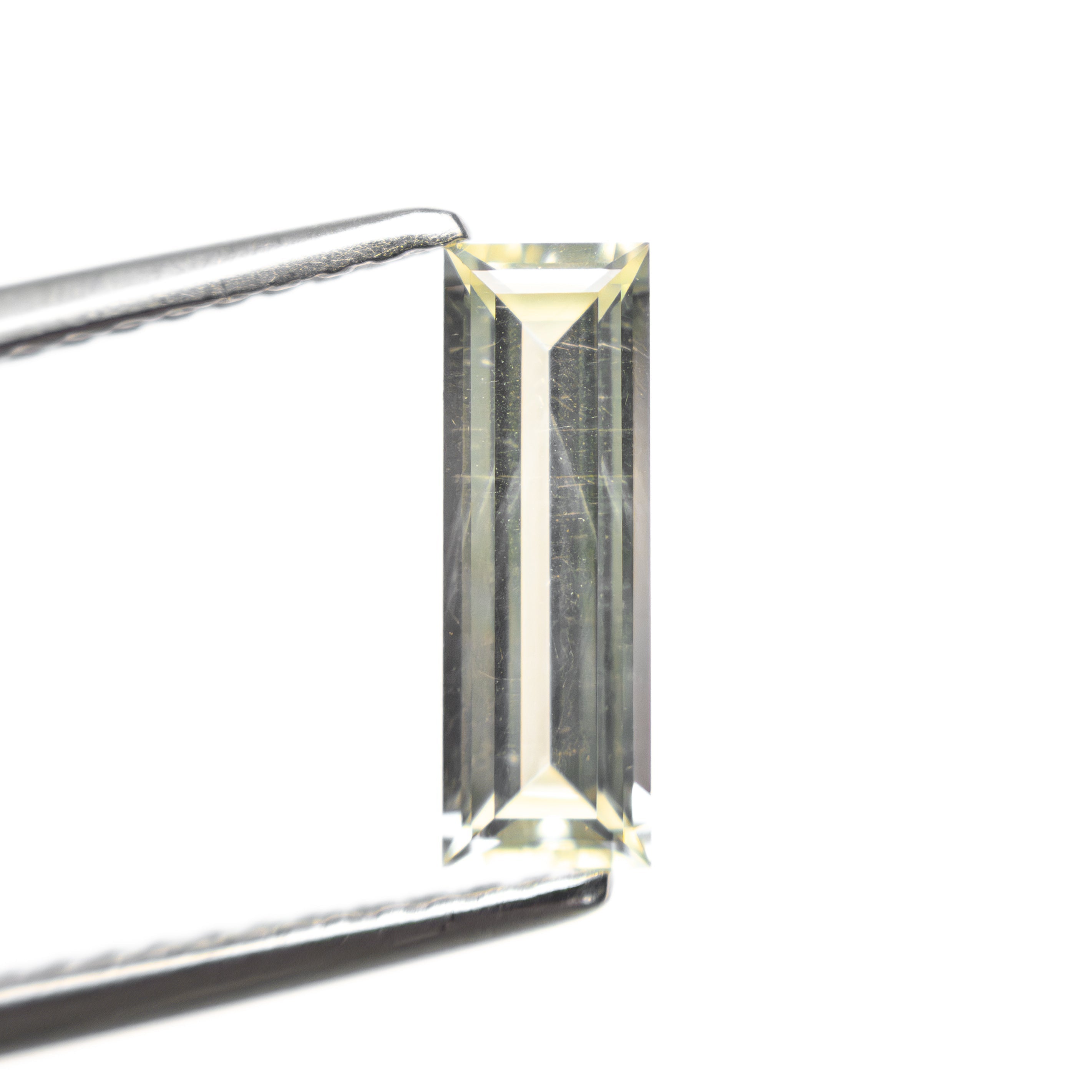 0.84ct 9.95x3.36x2.17mm Baguette Step Cut Sapphire 27719 - 01 - Lelya - bespoke engagement and wedding rings made in Scotland, UK