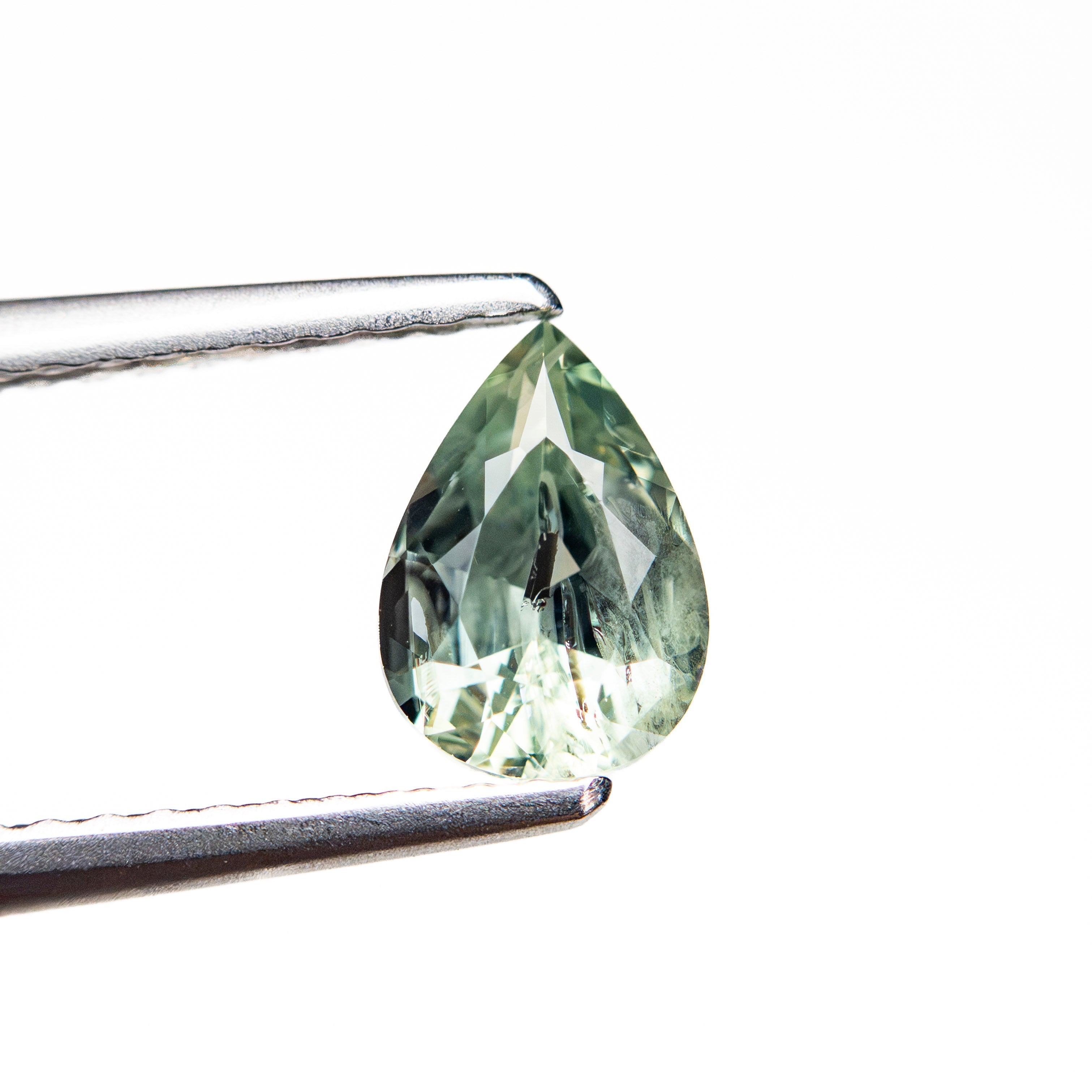 0.90ct 7.10x5.02x3.50mm Pear Brilliant Sapphire 26150-13 - Lelya - bespoke engagement and wedding rings made in Scotland, UK
