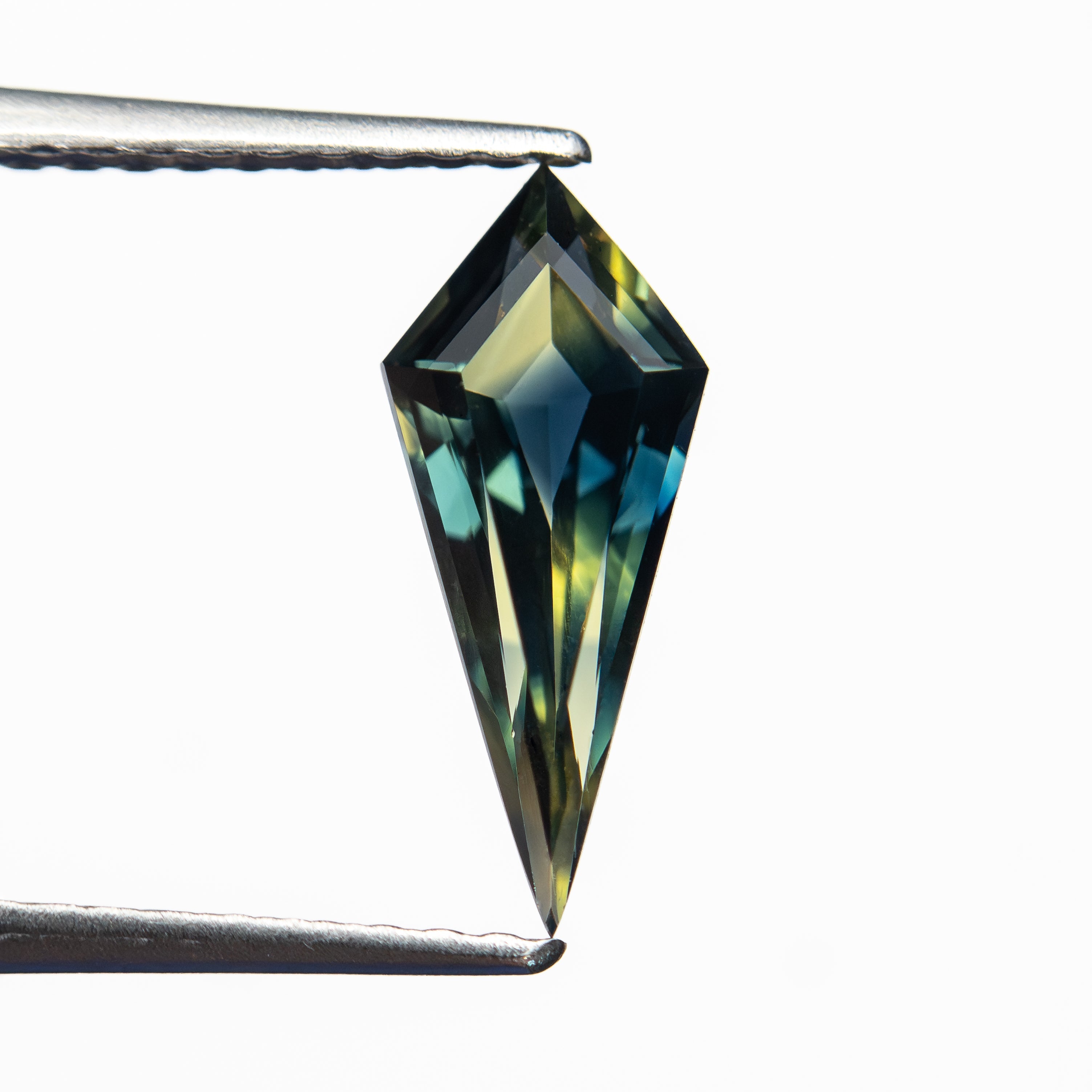 0.99ct 11.62x4.92x3.08mm Kite Step Cut Sapphire 27713-01 - Lelya - bespoke engagement and wedding rings made in Scotland, UK