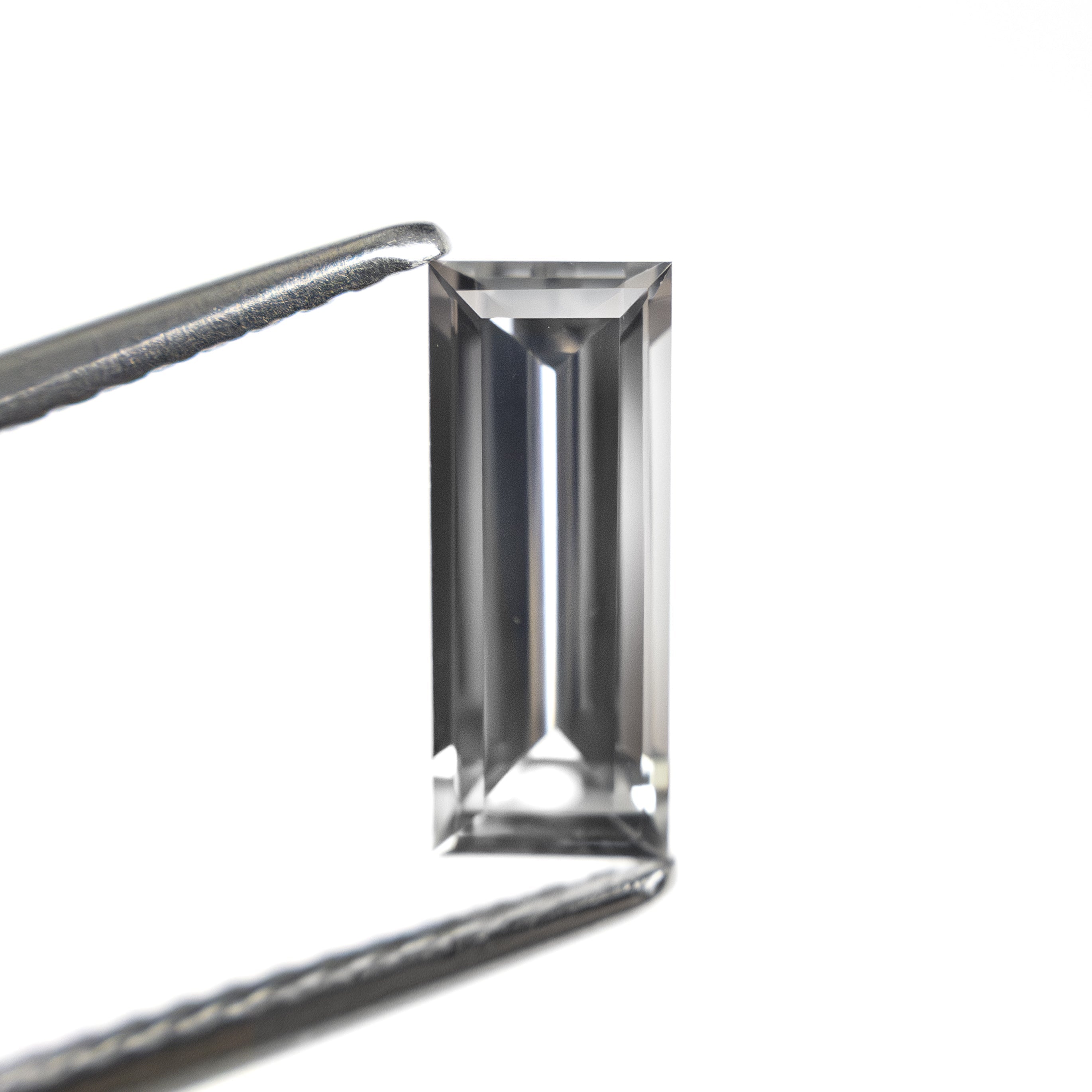 1.06ct 9.53x3.81x2.64mm Baguette Step Cut Sapphire 27720 - 07 - Lelya - bespoke engagement and wedding rings made in Scotland, UK