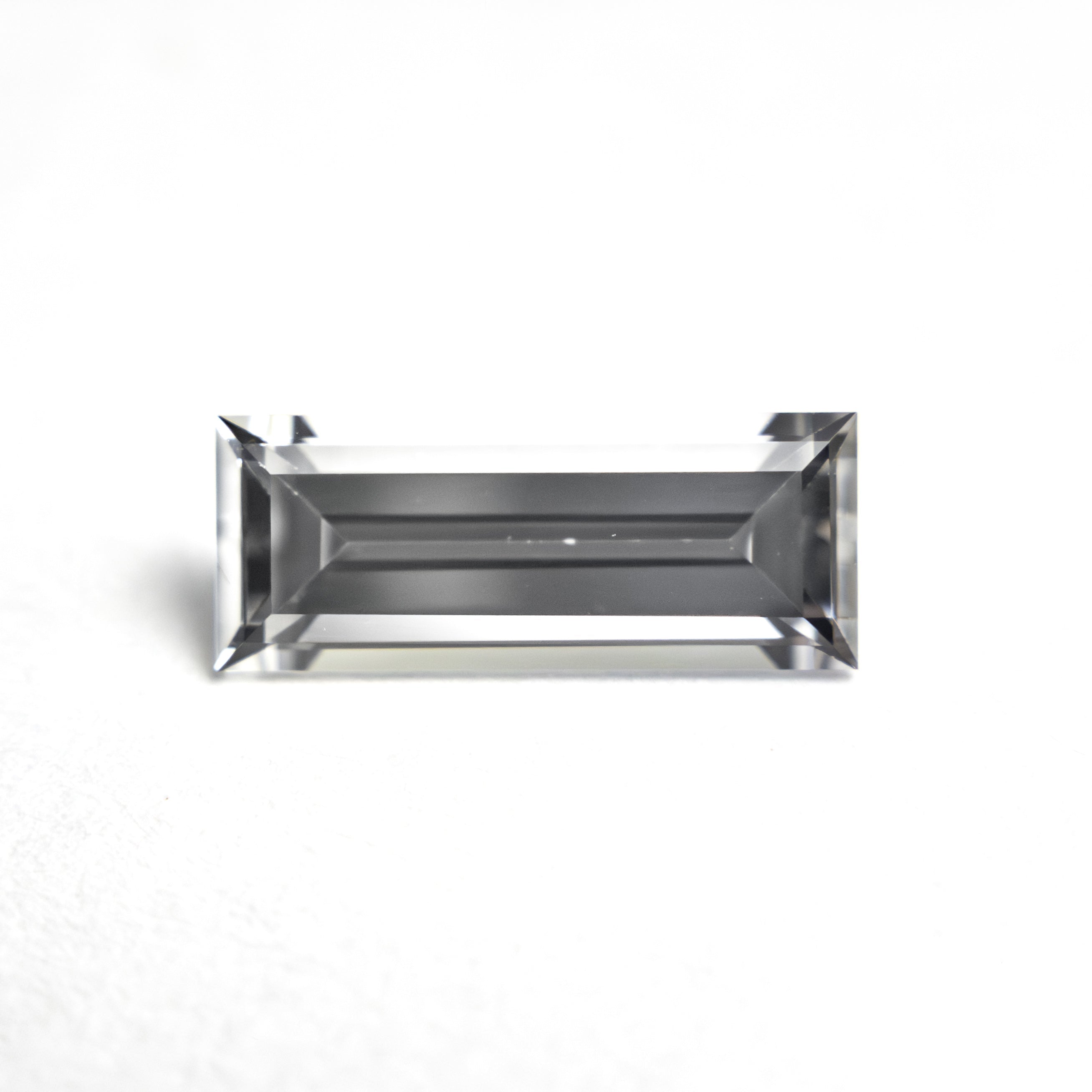 1.06ct 9.53x3.81x2.64mm Baguette Step Cut Sapphire 27720 - 07 - Lelya - bespoke engagement and wedding rings made in Scotland, UK