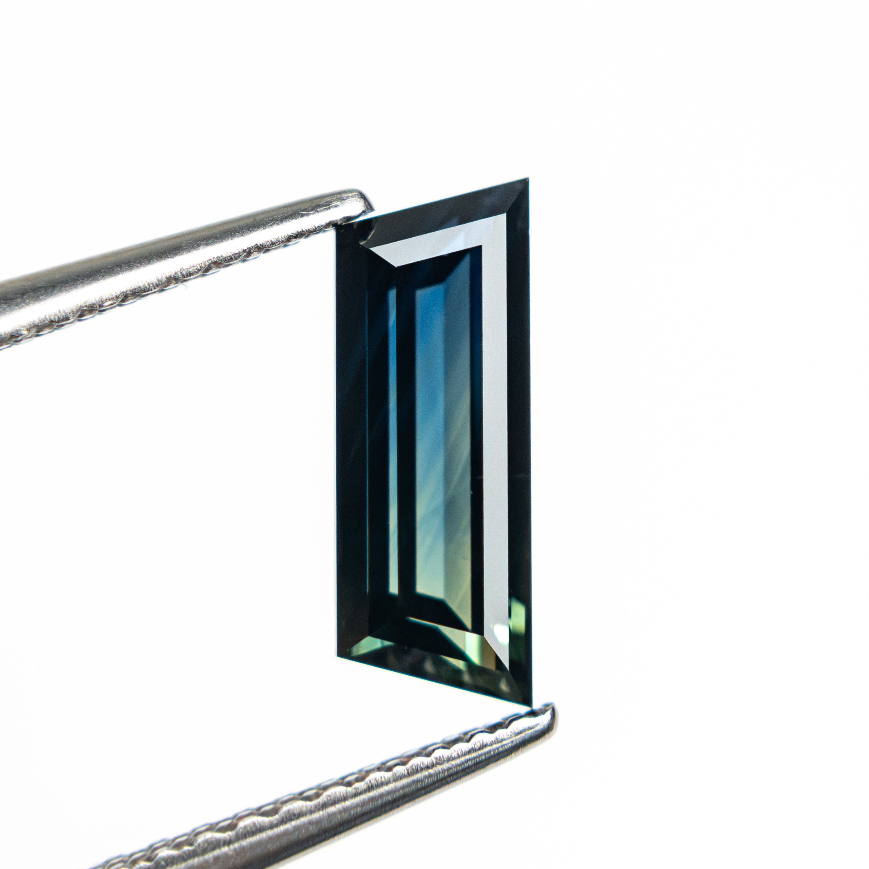 1.31ct 10.46x3.86x2.76mm Trapezoid Step Cut Sapphire 27766-11 - Lelya - bespoke engagement and wedding rings made in Scotland, UK