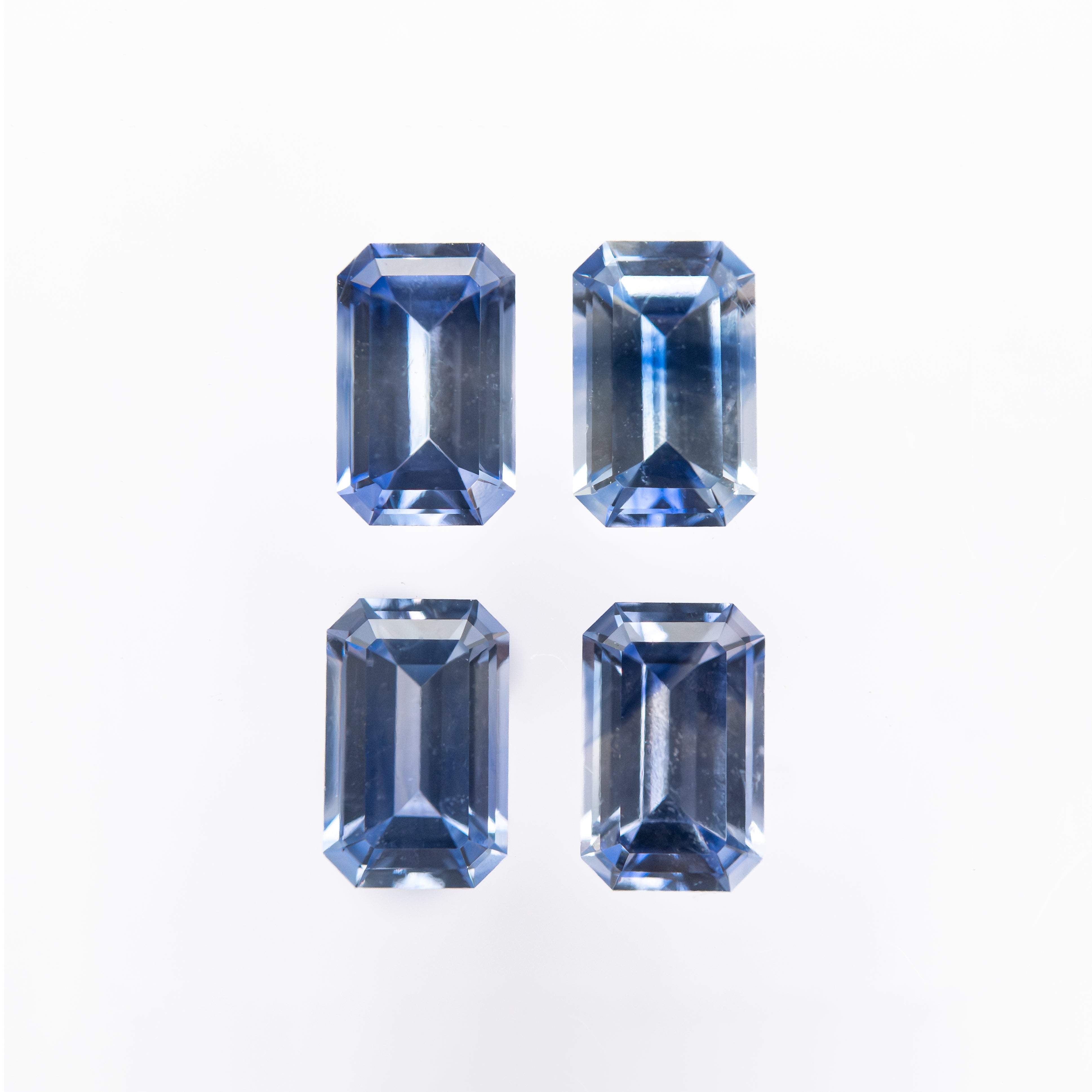 1.84cttw 4pc 5.5x3.5mm Cut Corner Rectangle Step Cut Sapphires 27723-01 - Lelya - bespoke engagement and wedding rings made in Scotland, UK
