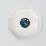 0.73ct Blue Teal Nebula Round Brilliant Sapphire - Lelya - bespoke engagement and wedding rings made in Scotland, UK
