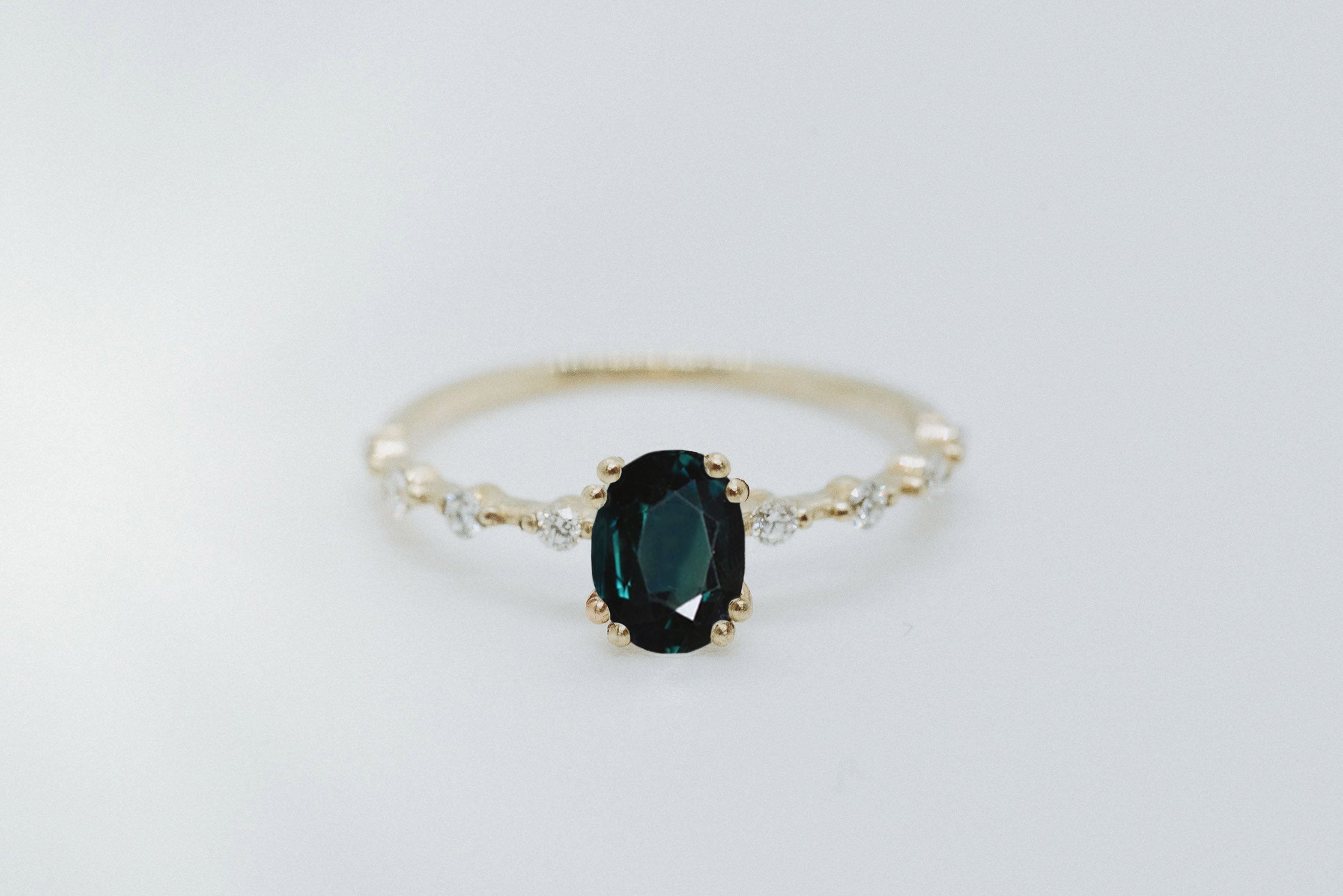 Oval Cut 1.2ct Dark Teal Sapphire - Lelya - bespoke engagement and wedding rings made in Scotland, UK